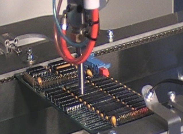 Selective spray robot applying conformal coating 640_SCHUK_1