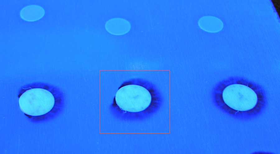 Some masking dots cause de-wetting in the conformal coating process