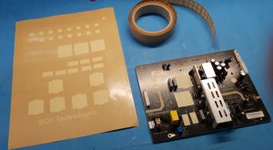 Pre-cut masking tape shapes and roll for conformal coating