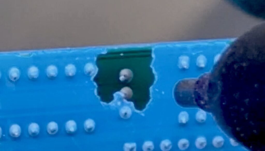 Micro-abrasive removal of conformal coating from PCB showing precise localised stripping without damaging solder mask or components