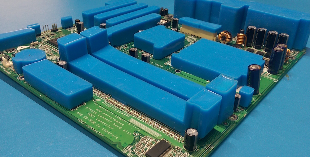 PCB masked with reusable masking boots on connectors ready for conformal coating