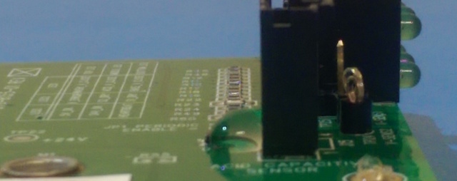 Water droplet on nano coated PCB showing hydrophobic protection preventing ingress into uncoated connector after acrylic conformal coating